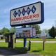 Chips hamburgers vintage sign, with ice-cream-cone-shaped sign beside it